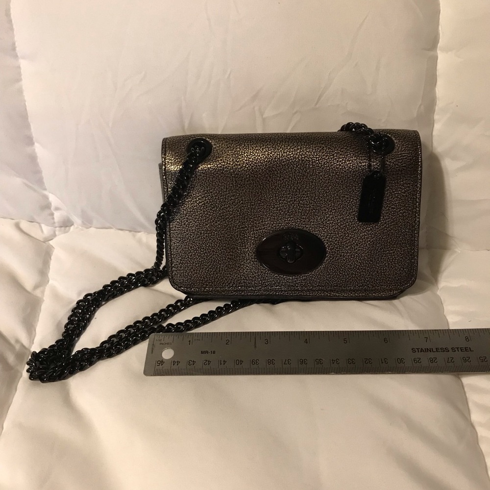 Metallic gold Coach crossbody bag